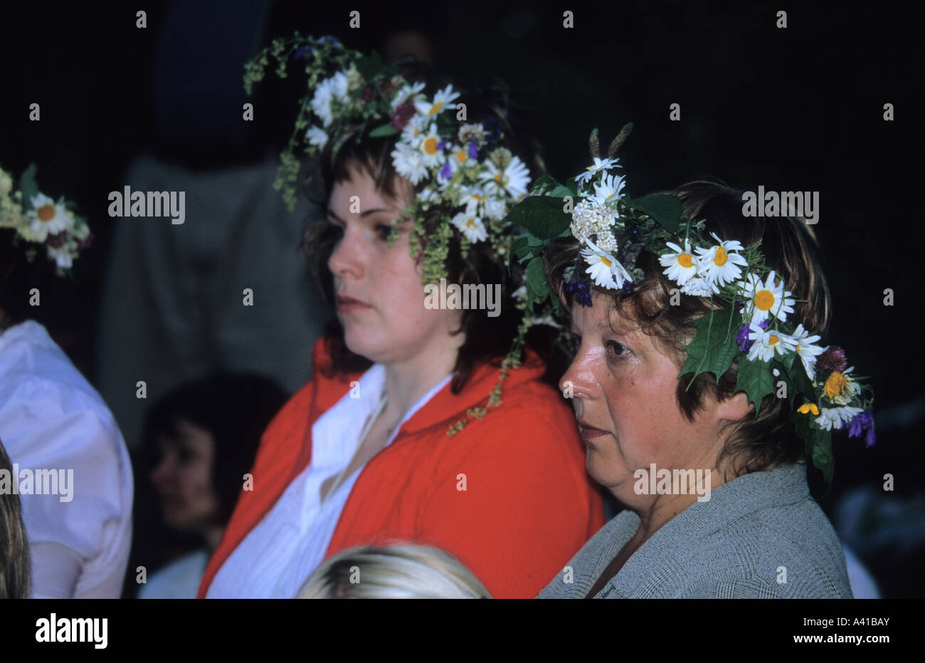 Latvian woman with garlands at summer solstice celebration Stock Photo