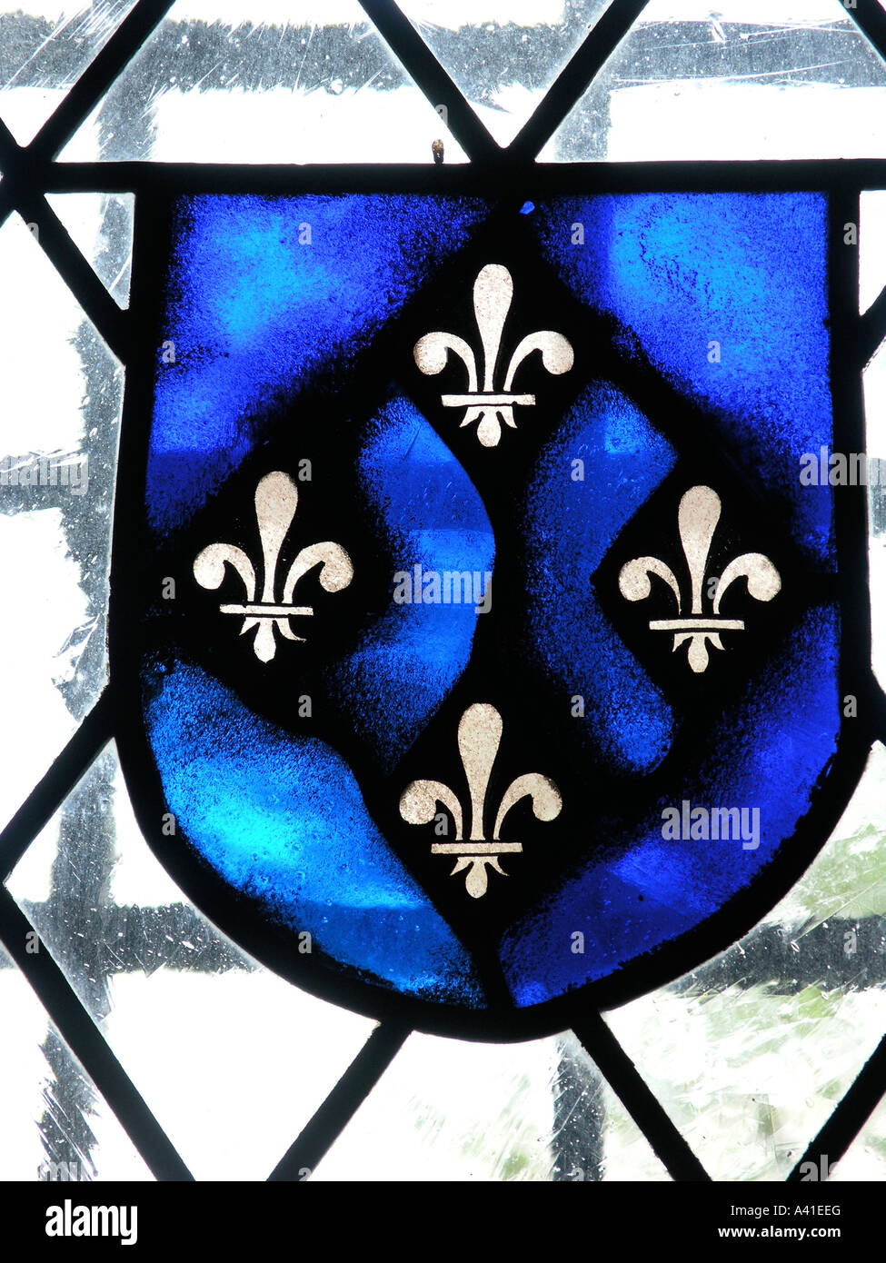 Stained glass fleur de lis symbol in an old castle Stock Photo