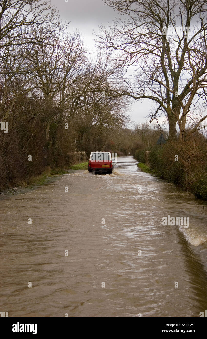 Country road flooded after heavy rain Stock Photo - Alamy