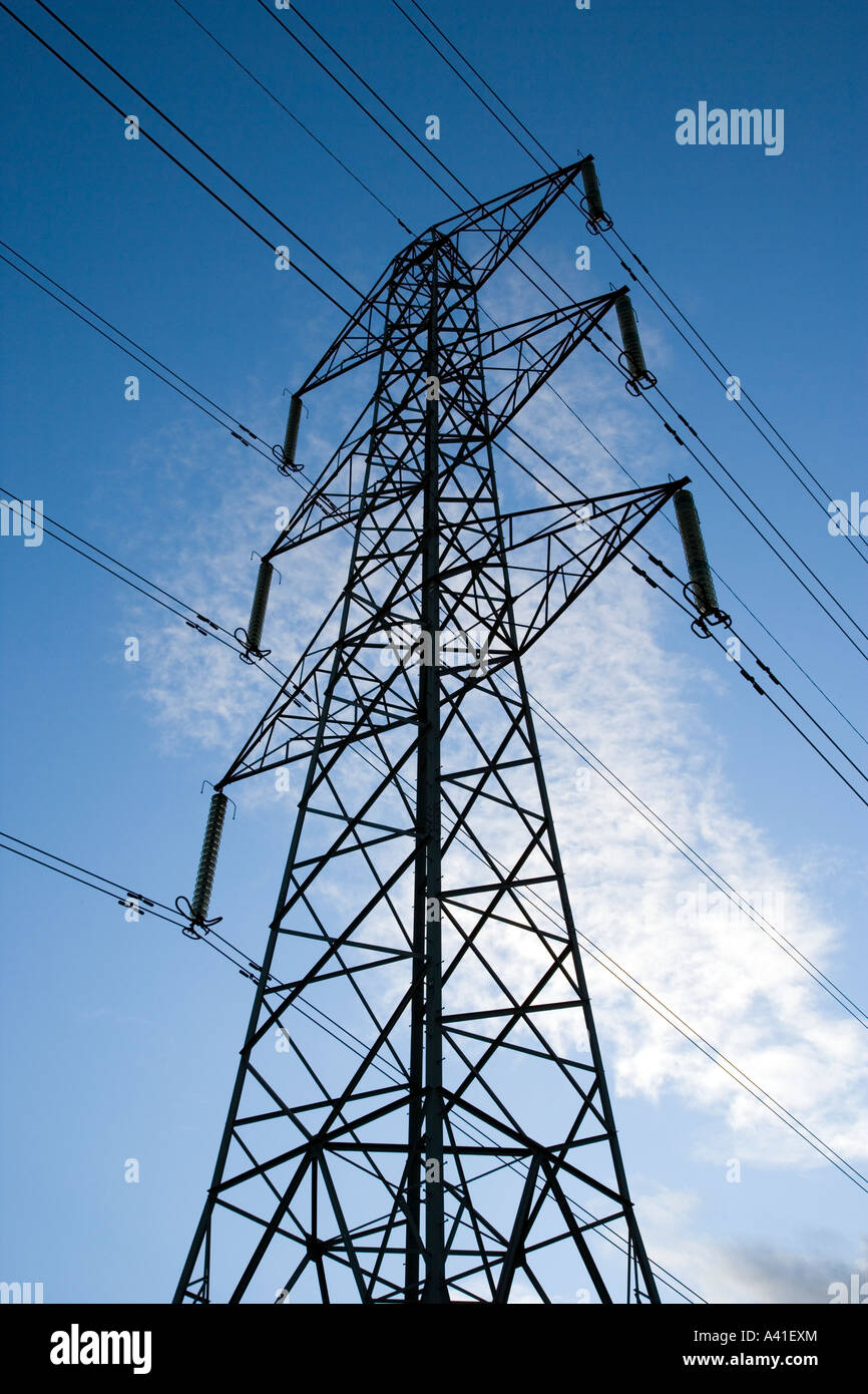 Imposing Electricity Pylon with a blue sky background Stock Photo - Alamy