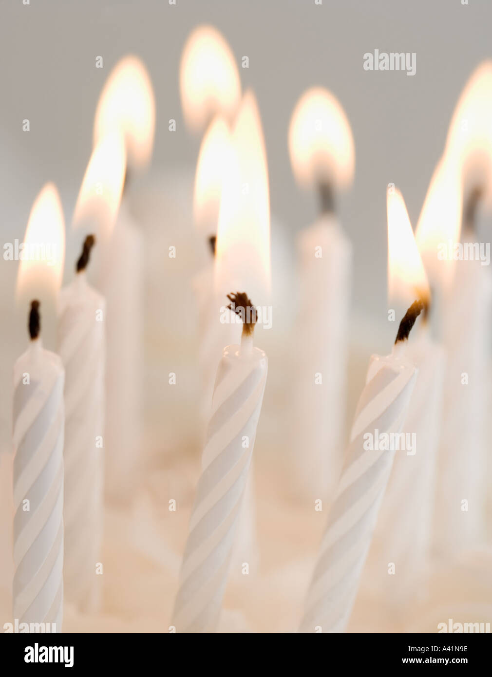 Lit birthday candles Stock Photo Alamy