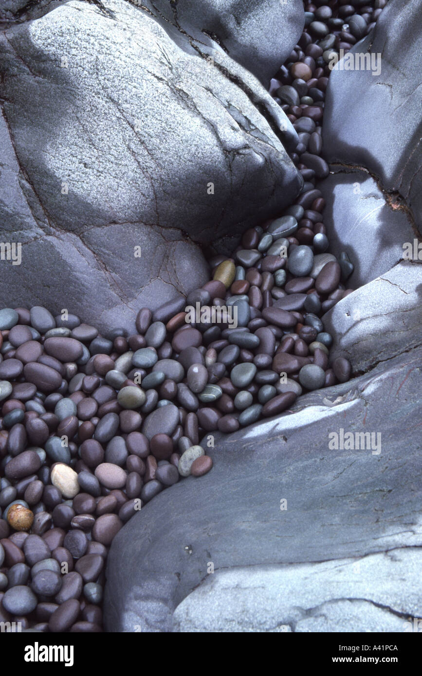 Smooth rocks and pebbles on beach Hurlstone Point Somerset England Stock Photo