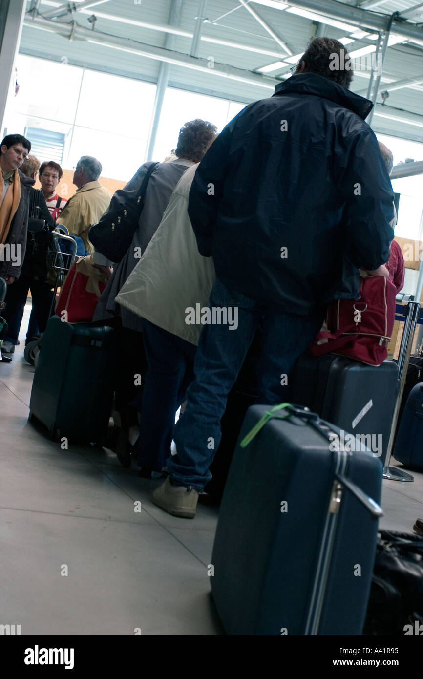Travelers boarding an airplane in nantes airport france Stock Photo