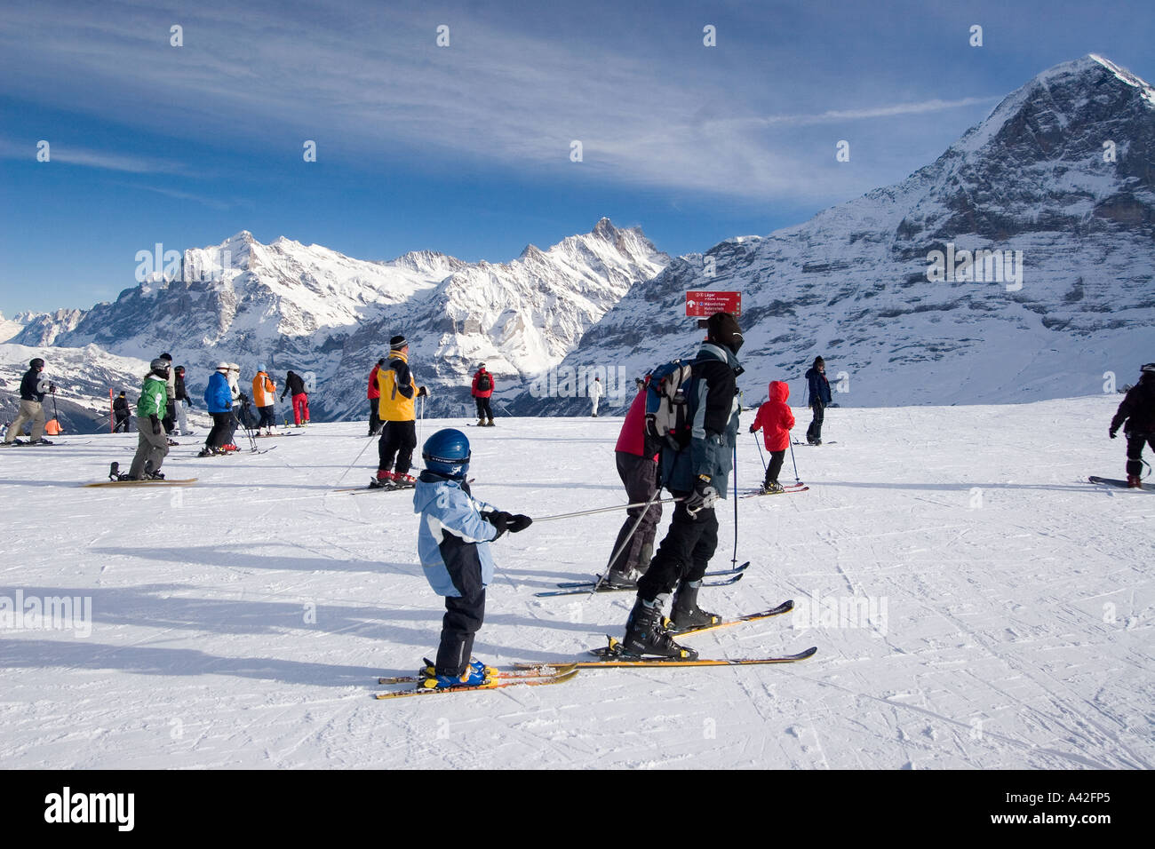 Switzerland bernese alps Mount Maennlichen skiing and snowboarding piste beautifil panoramic view to bernese alps Mount Eiger Mo Stock Photo