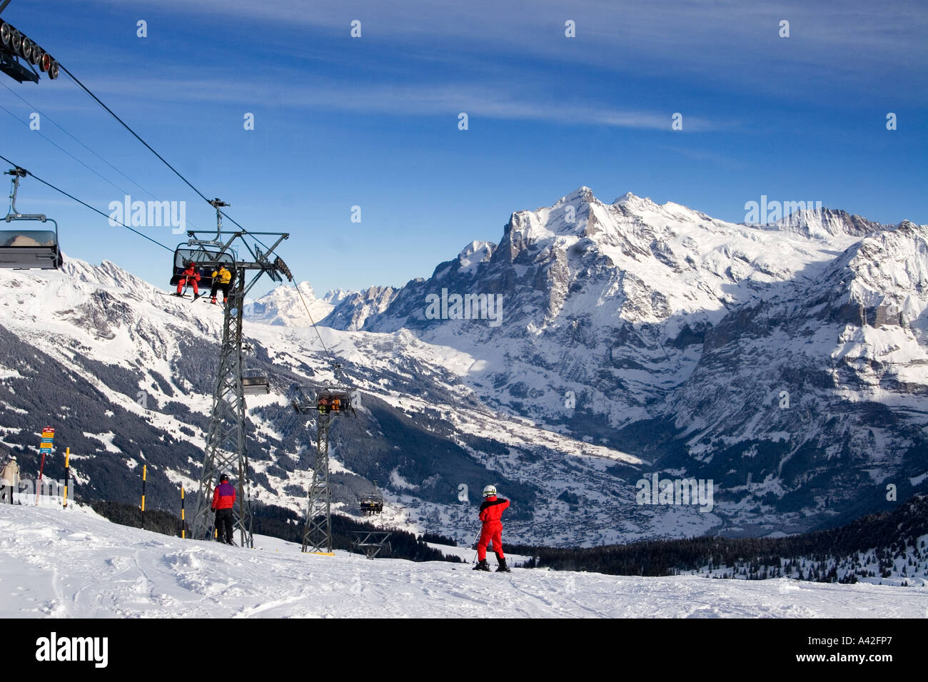 Switzerland bernese alps Mount Maennlichen skiing and snowboarding piste beautifil panoramic view to Mount Eiger Moench Jungfrau Stock Photo