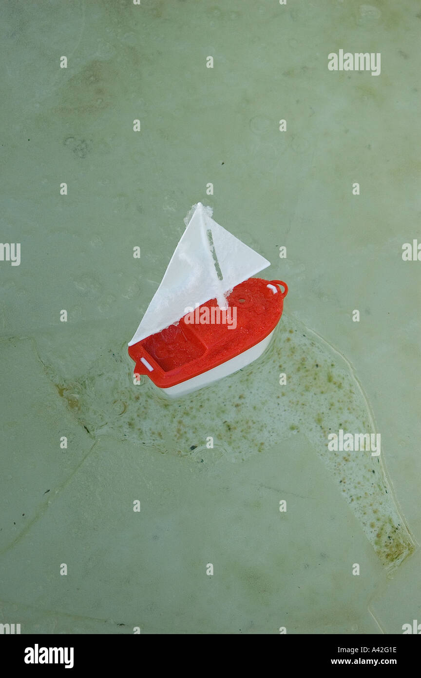 toy boat floating on water Stock Photo - Alamy