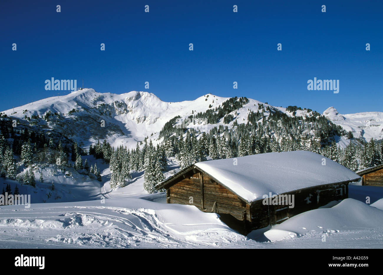 Old chalets near the ski slopes of Bretaye Villars Switzerland Chamossaire ski lift in the background Stock Photo