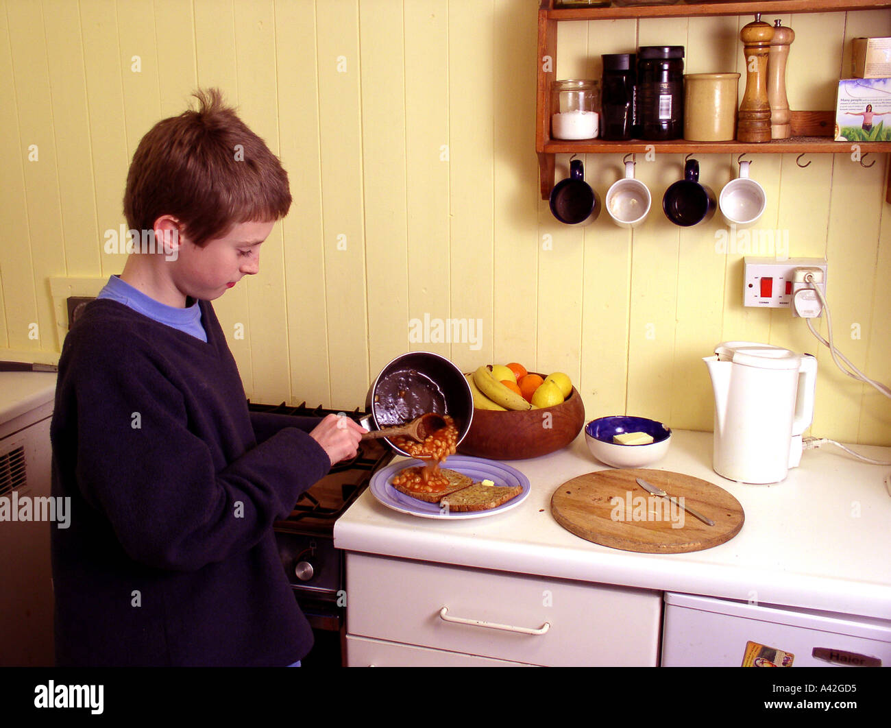 boy 11 years old cooking breakfast domestic kitchen Oscar Hanna 11