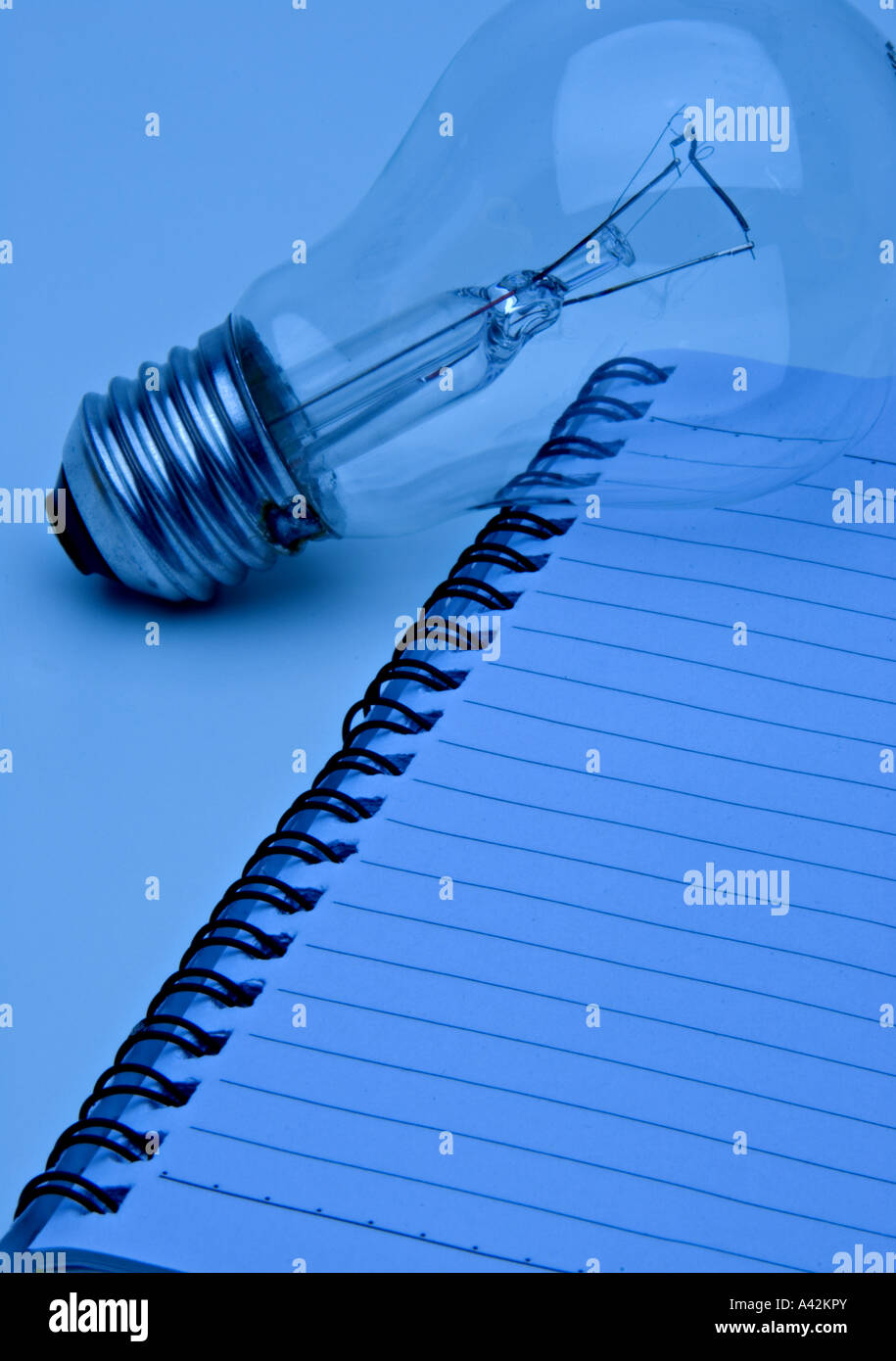 Business note pad and light bulb abstract Business Concept Stock Photo ...