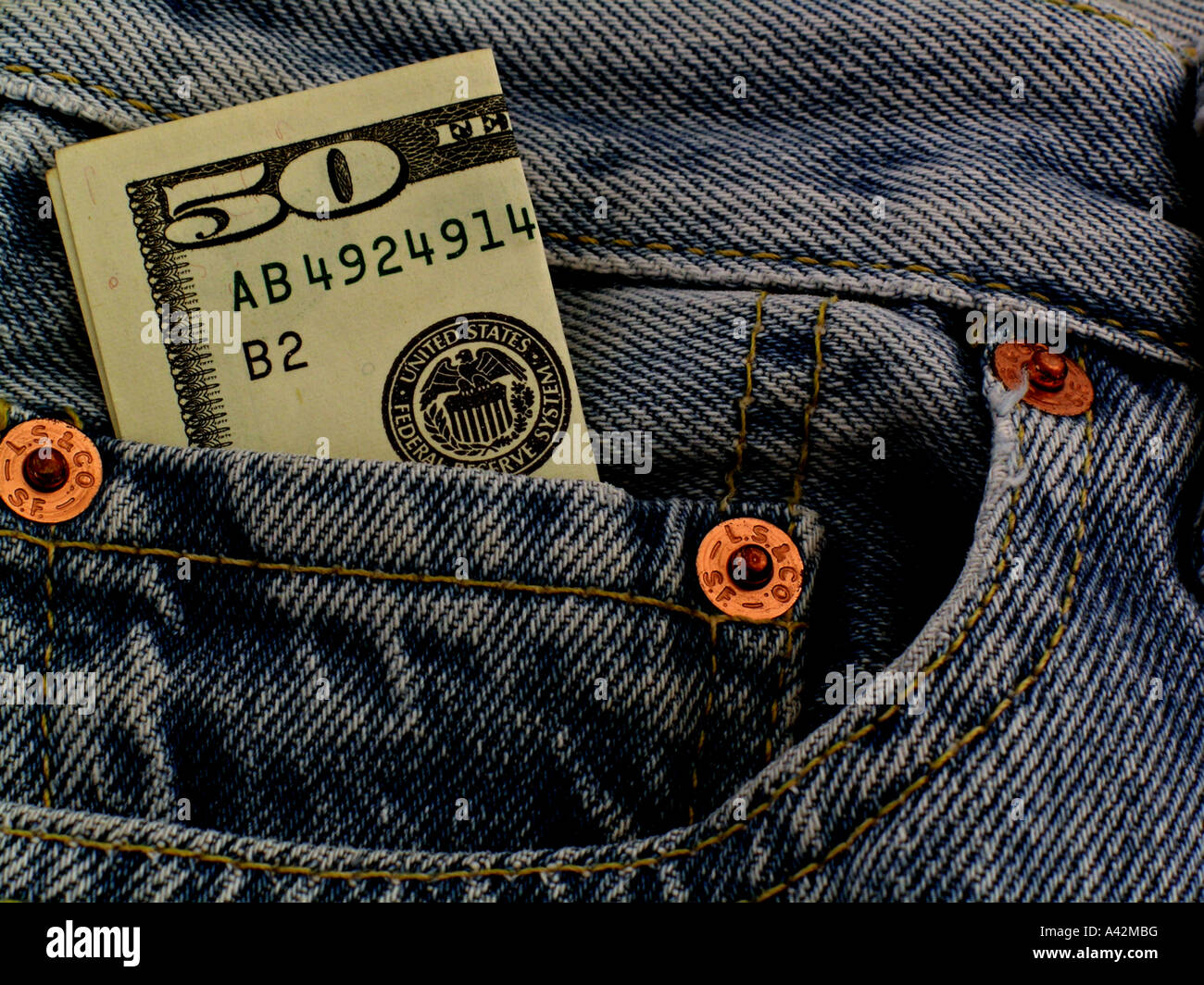 Fifty dollar bill in Denim Jeans, Americana Conceptual Stock Photo