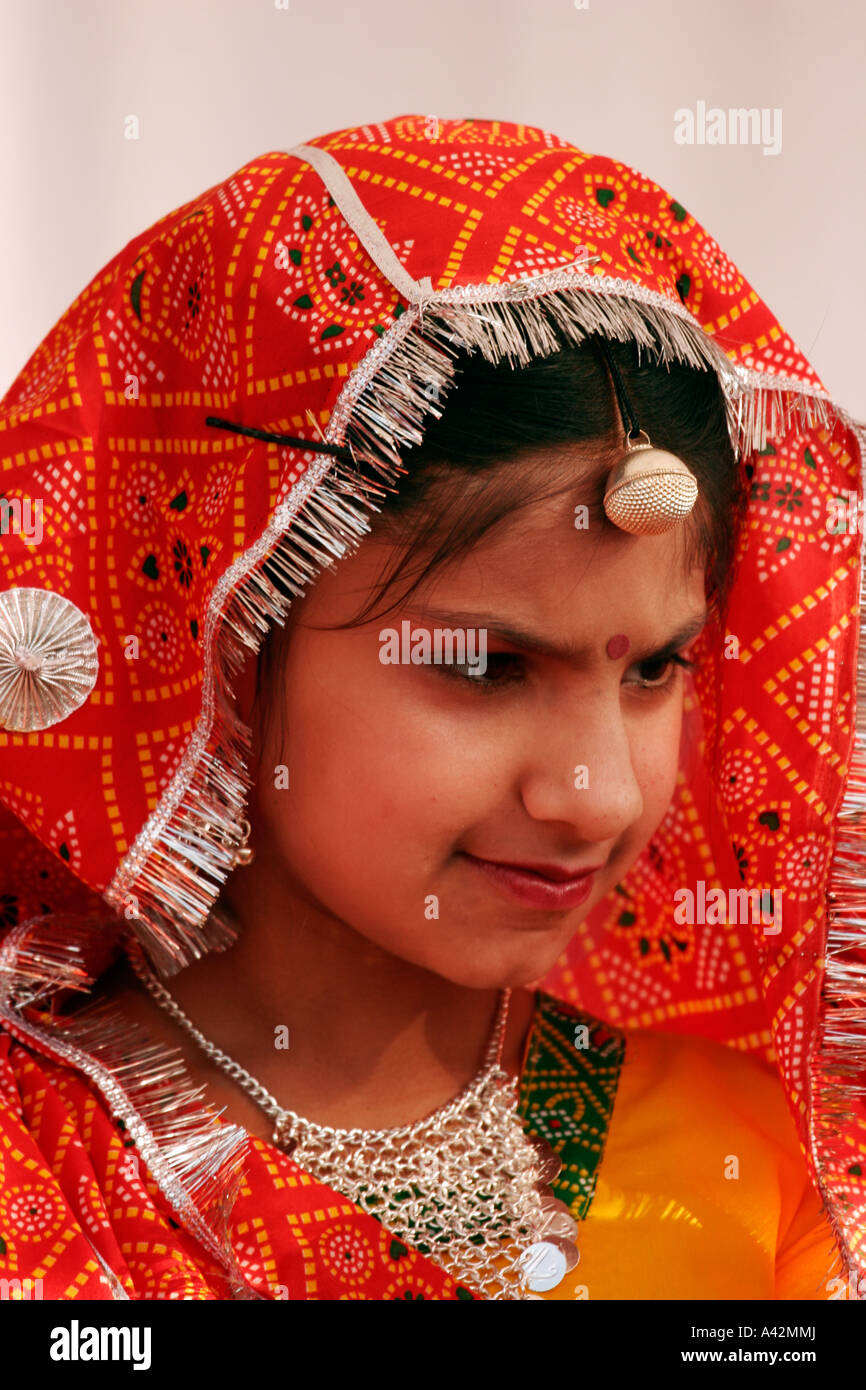 Young girls dressed in an ethnic dress, waiting for their turn to