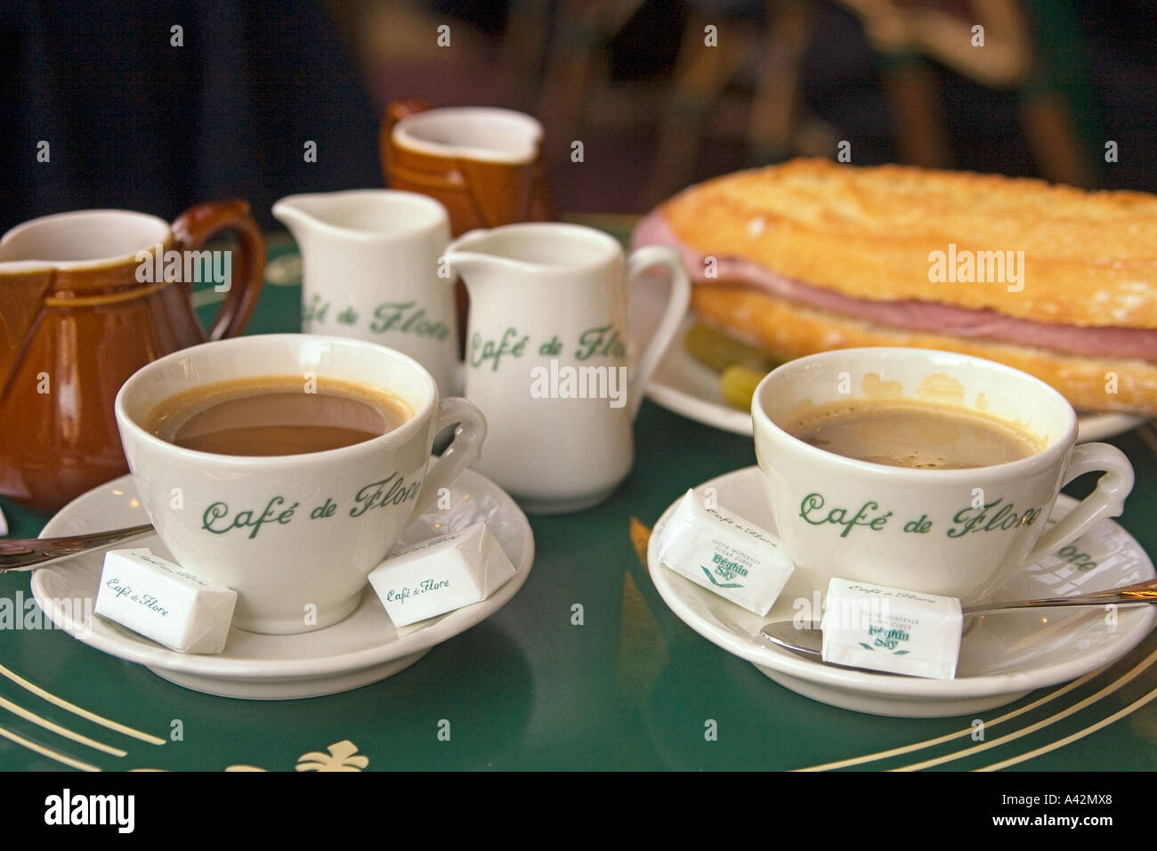 Paris St German Cafe de Flore table with cafe creme and sandwich Stock Photo