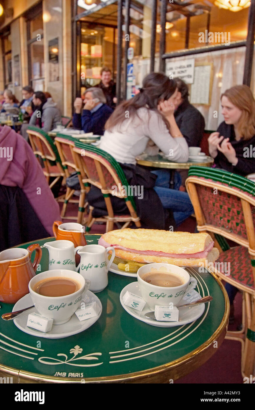 Paris St German Cafe de Flore table with cafe creme and sandwich Stock Photo