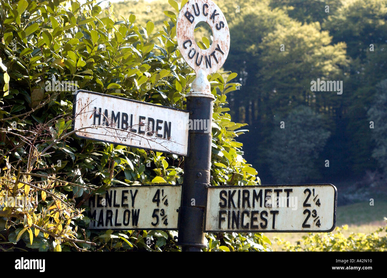 Sign pointing along a country lane in Buckinghamshire towards Hambleden village. Stock Photo