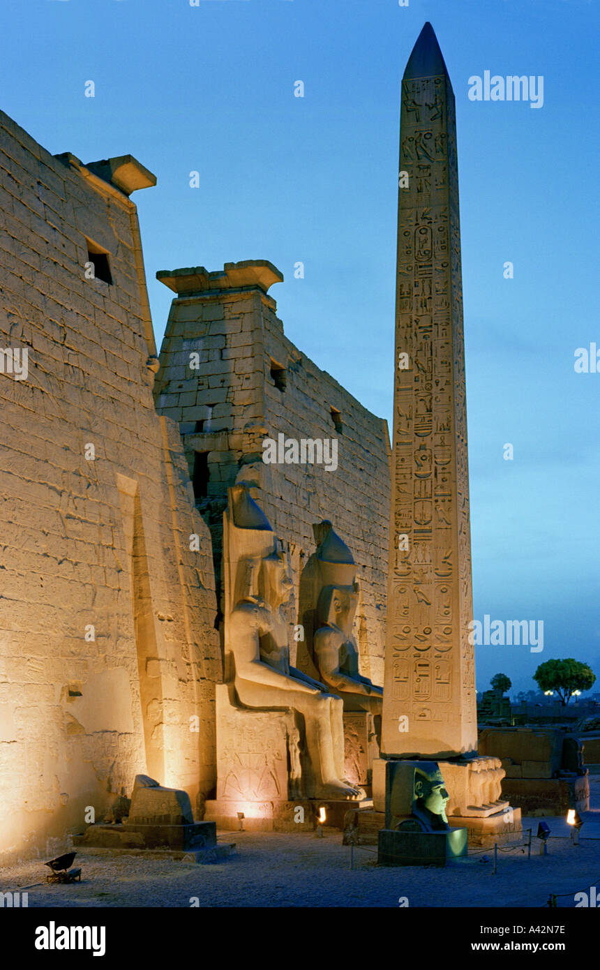 The magnificent Temple of Luxor at dusk with colossal statues of Ramses ...