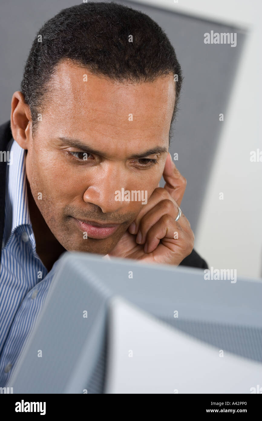 Man in front of computer Stock Photo - Alamy