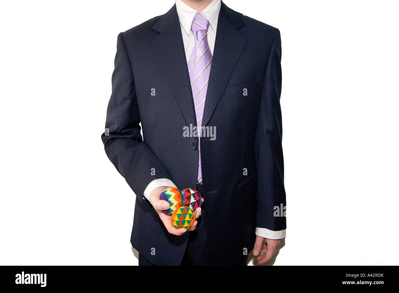 Elegant businessman with three juggle balls in one hand Stock Photo Alamy