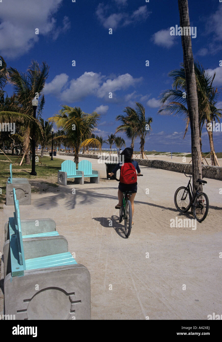 girl riding a bicycle in Miami Beach Florida USA Stock Photo
