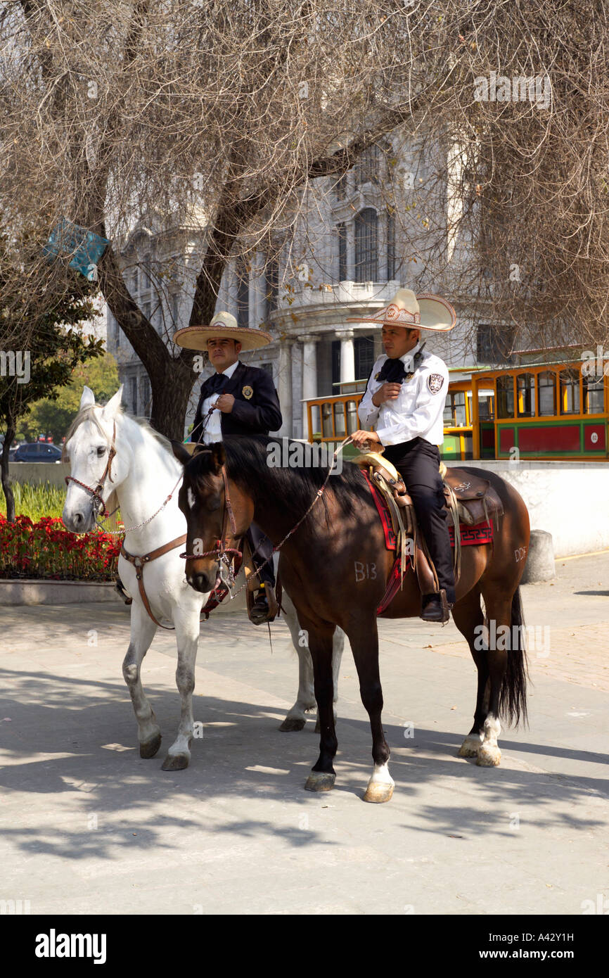 Two mounted police on horseback in the Alameda Central Park outside the Palacio de Bellas Artes - Palace of Fine Arts Av, Juárez Stock Photo