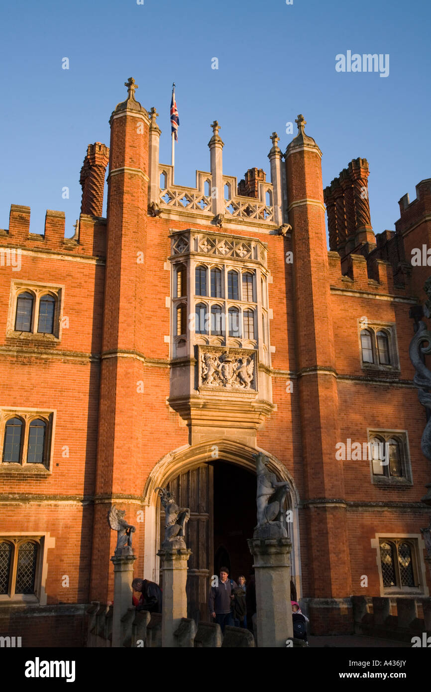 Visitors leave Hampton Court Palace at closing time from West Front entrance Hampton Court Palace UK Stock Photo