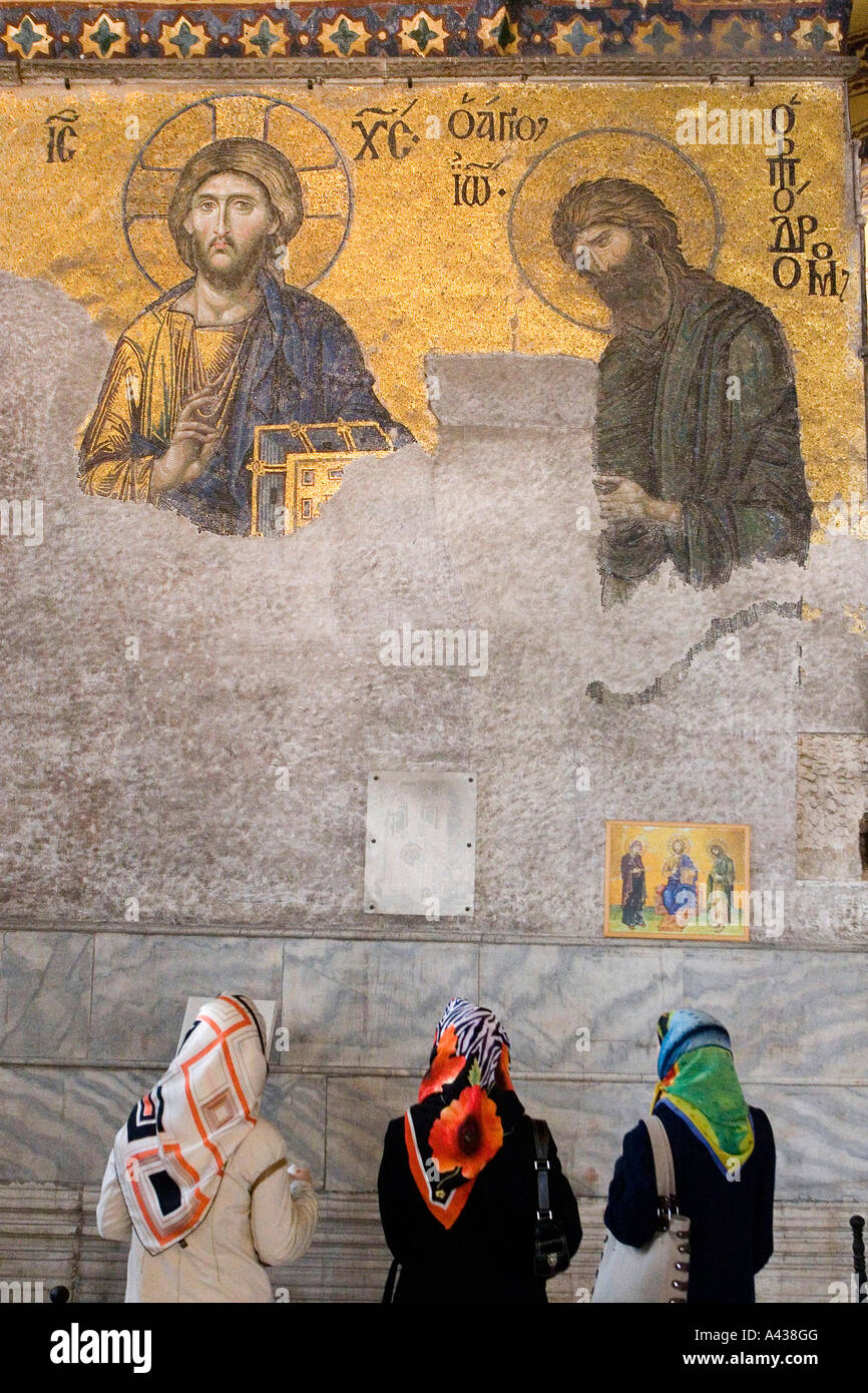 Muslim women looking at ikonas in Hagia Sophia, Istanbul Turkey. Stock Photo