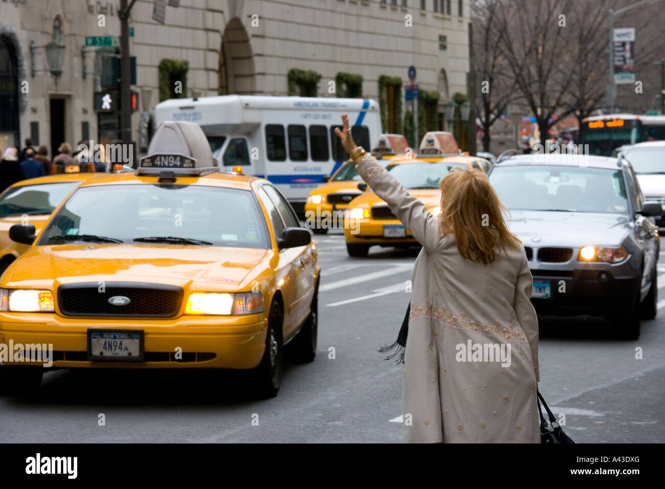 woman-hailing-a-cab-on-new-york-street-stock-photo-alamy