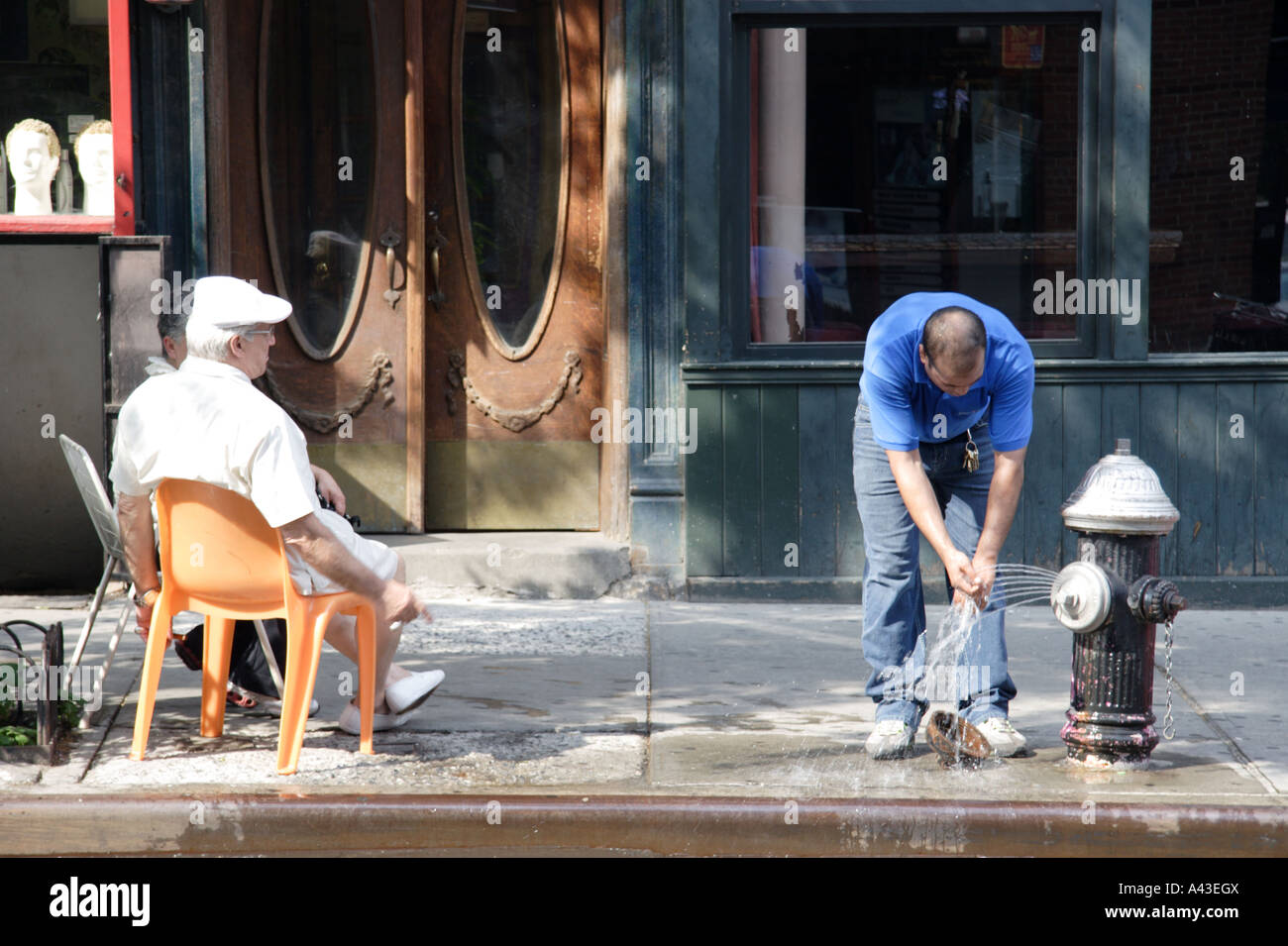 Open fire hydrant in New York City Stock Photo Alamy