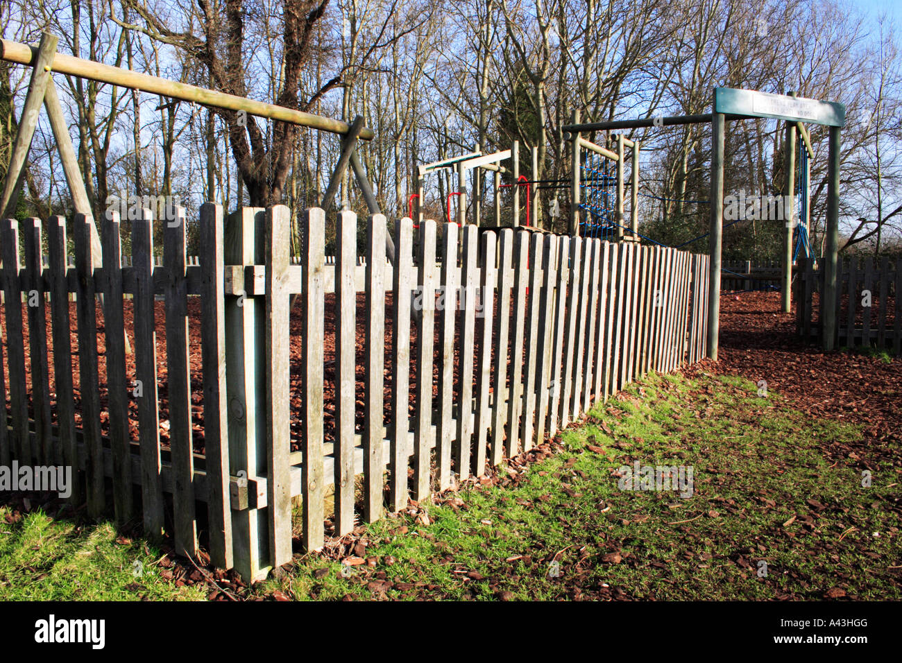 Fence around a playground Stock Photo - Alamy