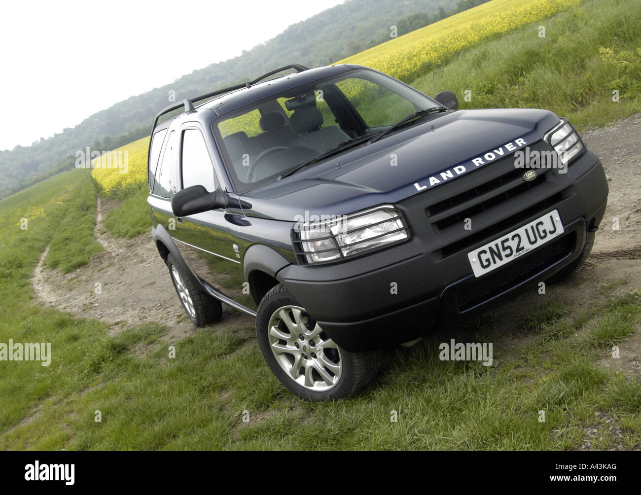 2002 Land Rover Freelander Mark 1 off road in the countryside. Oslo blue Vortex alloy wheels light guards roof bars Stock Photo