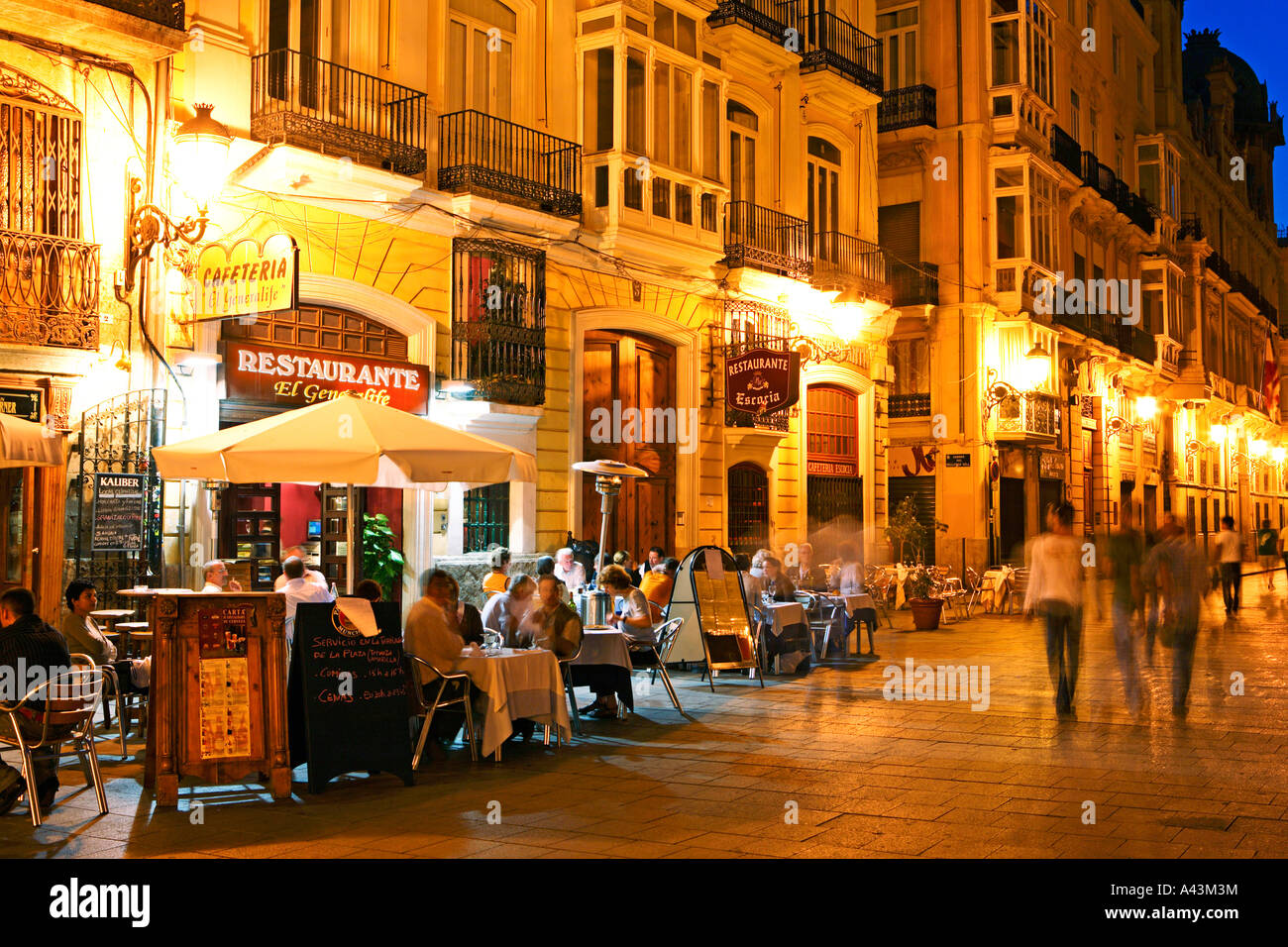Spain Valencia People In Restaurants On Plaza De La Virgen Stock