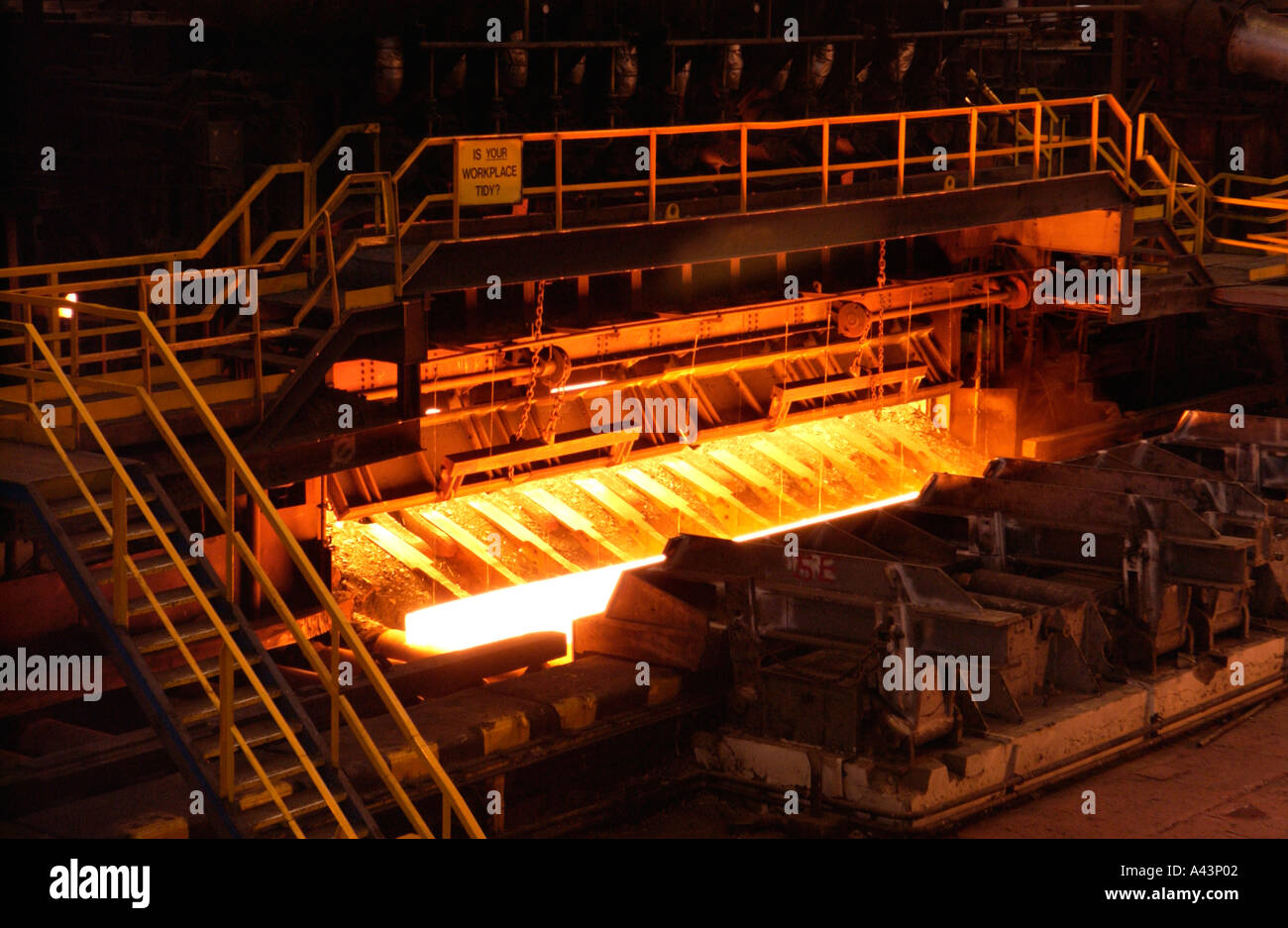 Slab coming out of the reheating furnace on the hot strip mill at Corus Llanwern steelworks Newport South Wales UK Stock Photo