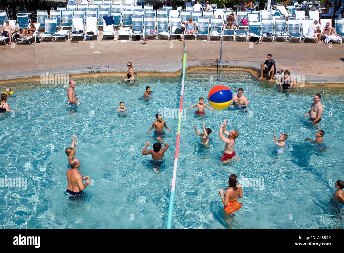 People playing water volleyball in resort swimming pool at Walt Disney