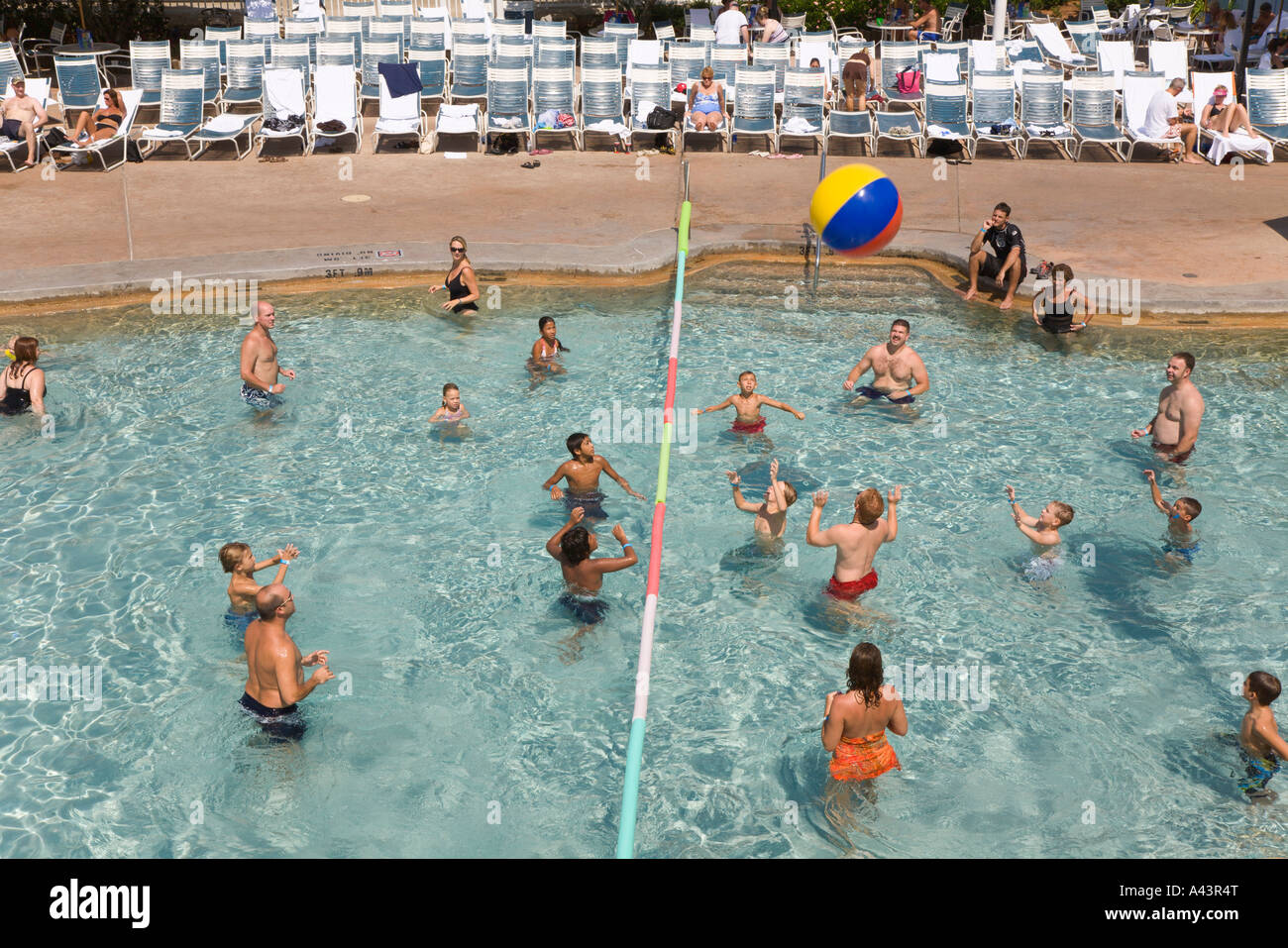 People playing water volleyball in resort swimming pool at Walt Disney
