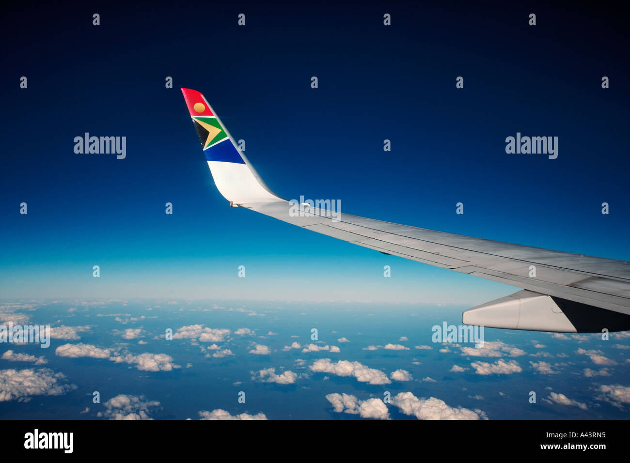 View out of passenger plane showing wing of South African Airways No property release Stock Photo