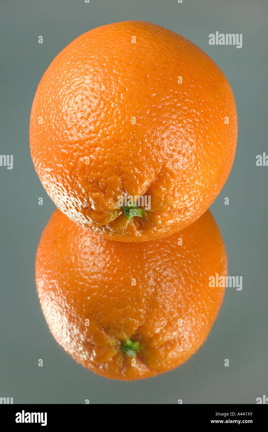 Orange reflected on a piece of mirror card Stock Photo