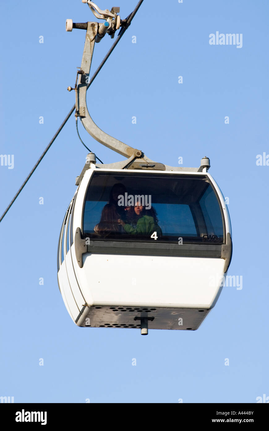Woman enjoying the view of PARQUE DAS NACOES or Park of Nations from a cable-car ride TELEFERICO in Lisbon Portugal Stock Photo