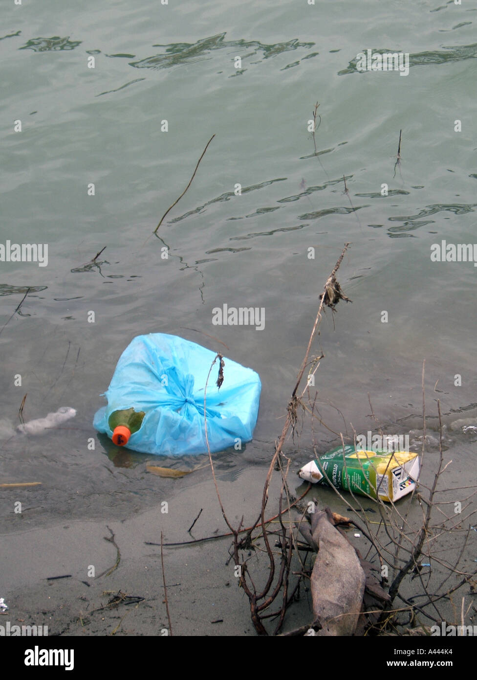 rubbish in river Stock Photo - Alamy