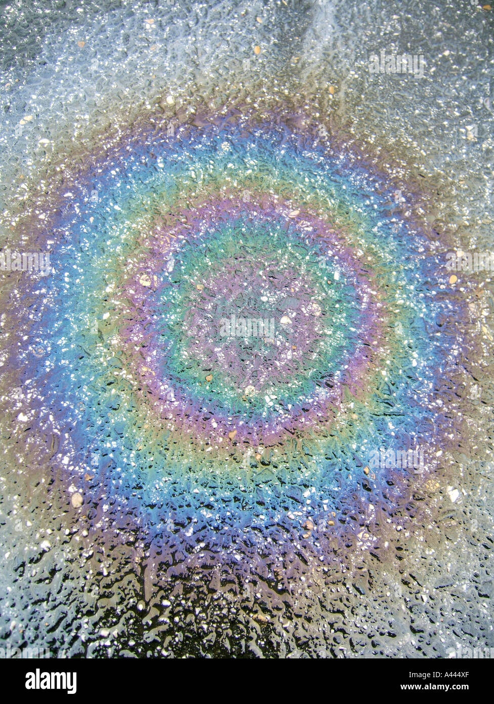 circular oil spillage on wet rainy road Stock Photo Alamy
