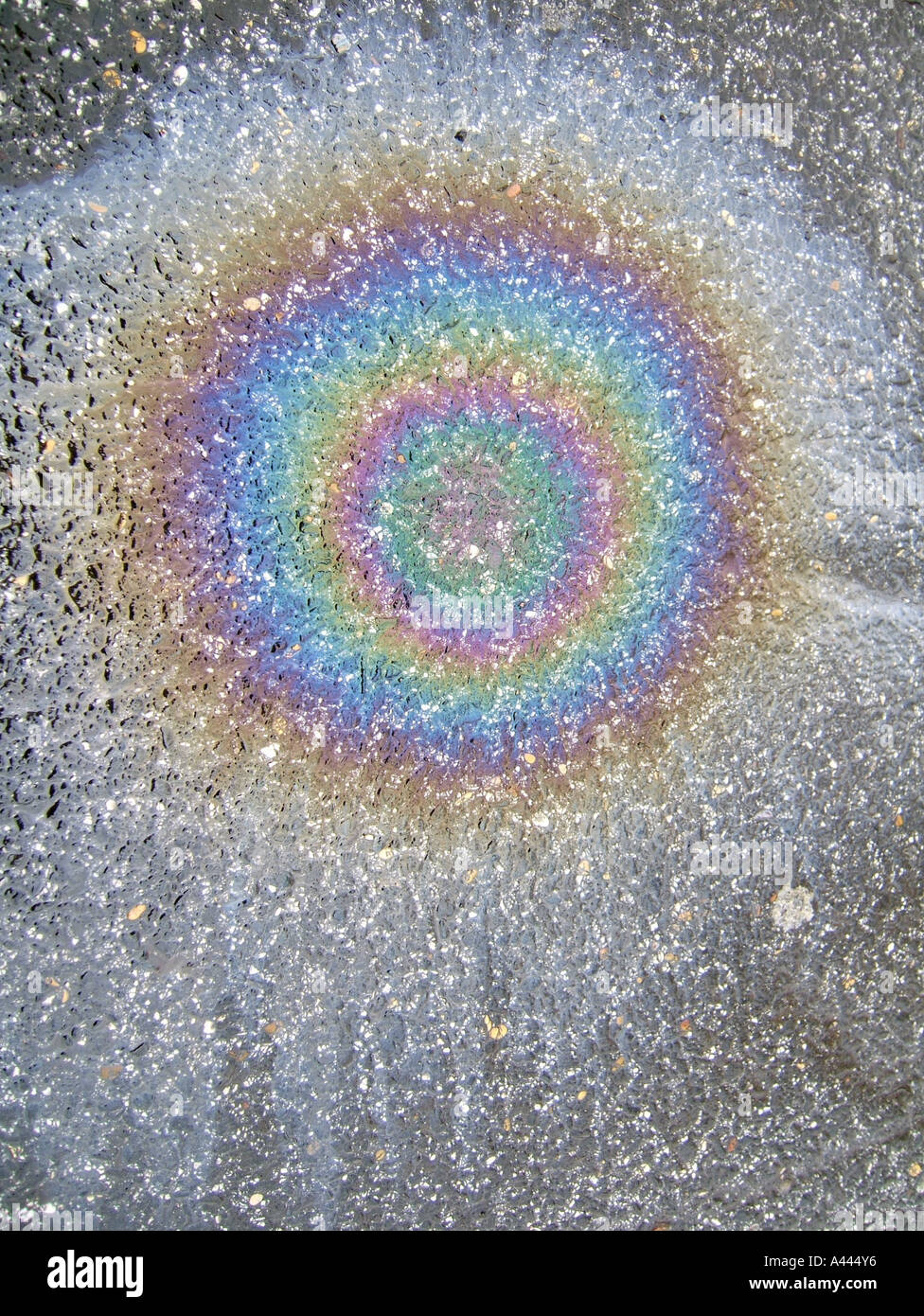 circular oil spillage on wet rainy road Stock Photo Alamy