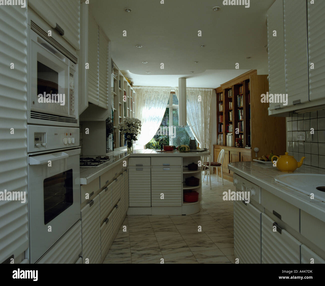 Wallmounted ovens in white eighties kitchen diningroom Stock Photo Alamy