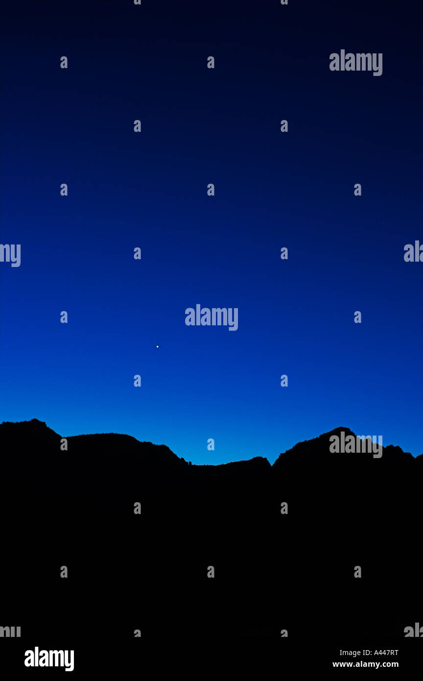 Venus rises in the blue dawn light over the hills of Sedona, Arizona Stock Photo