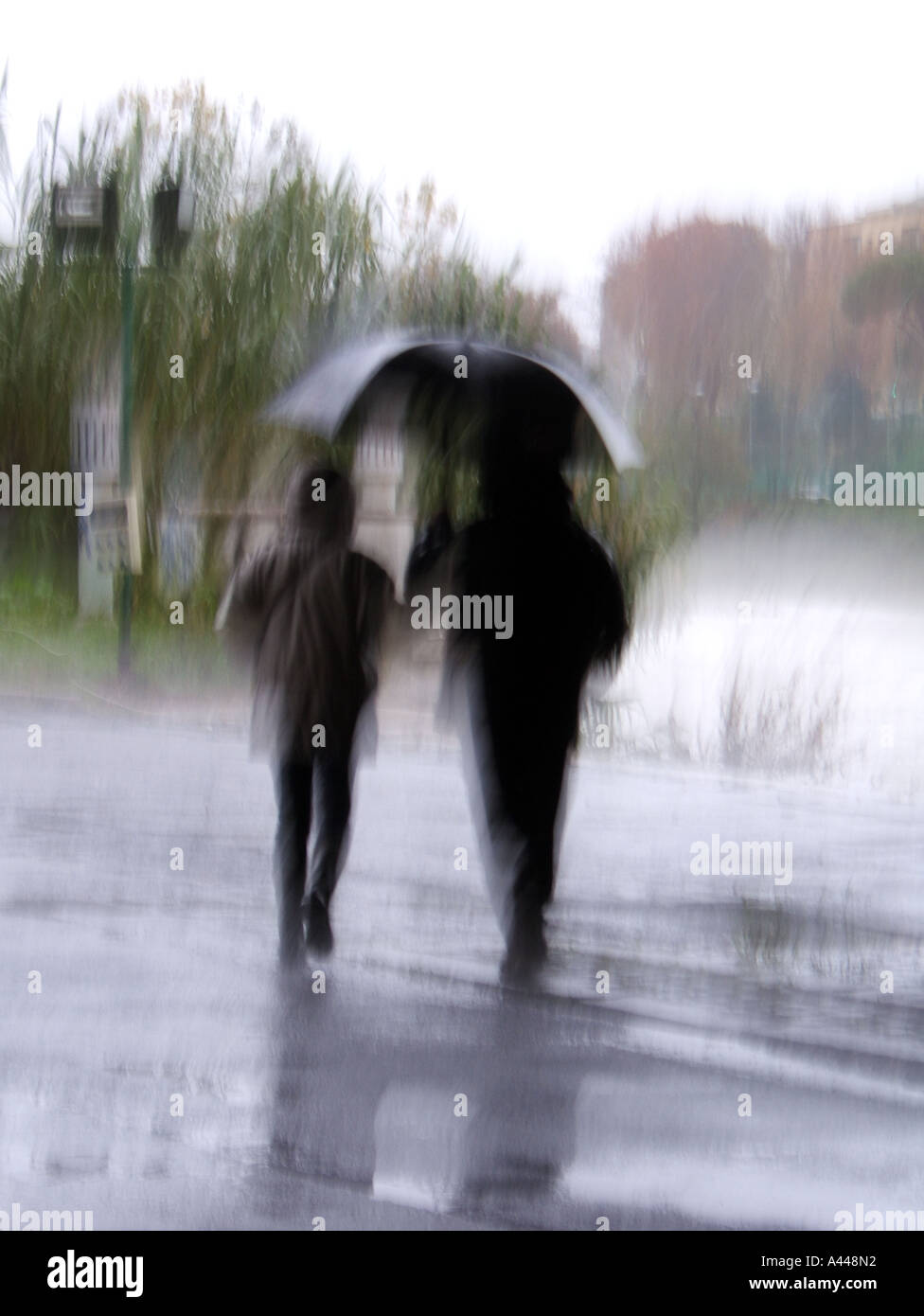 couple with umbrella Stock Photo - Alamy