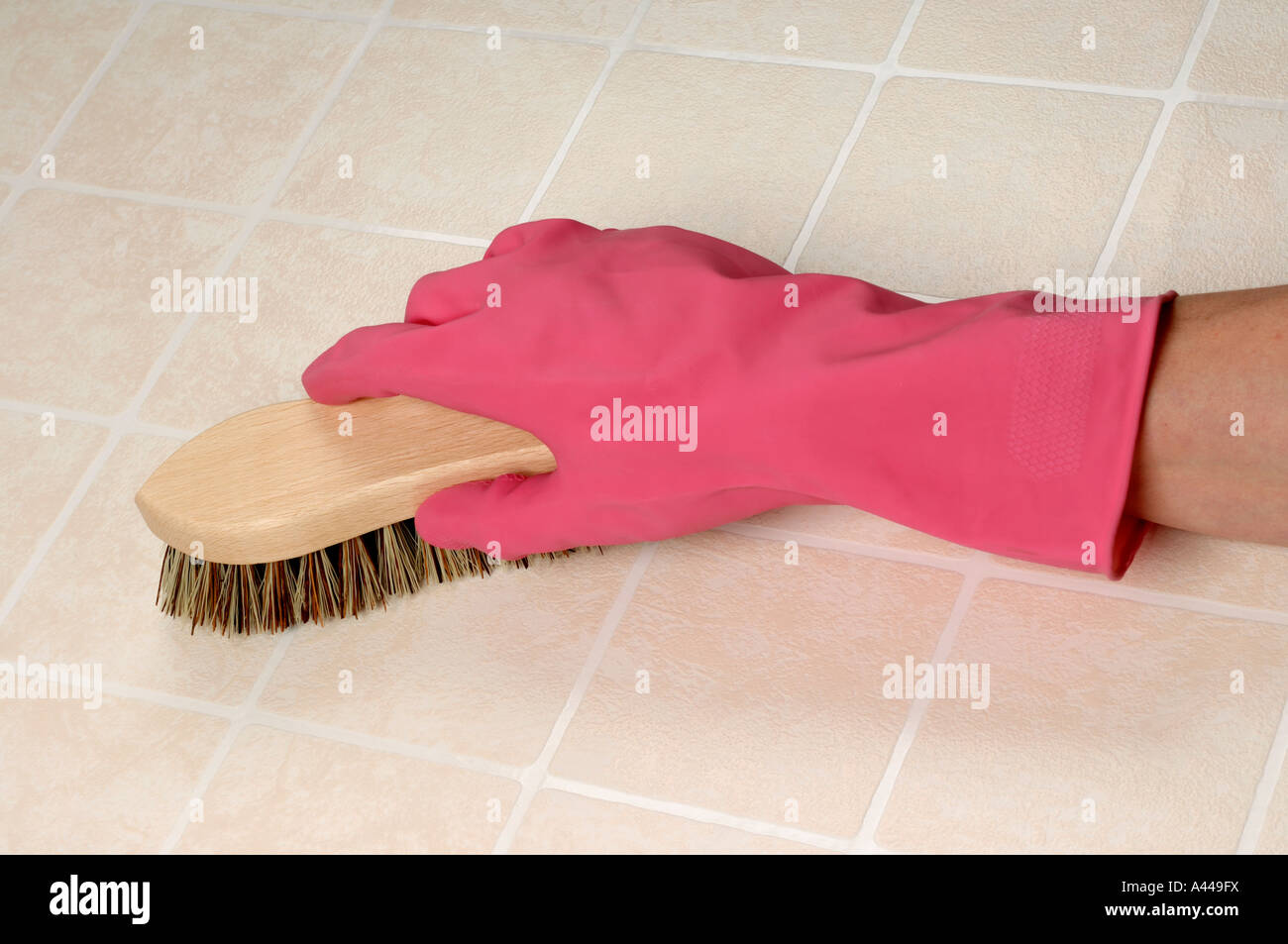 Scrubbing brush pink glove Stock Photo