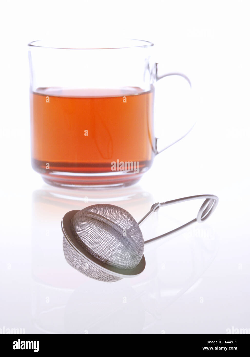 Tea with tea strainer. Stock Photo