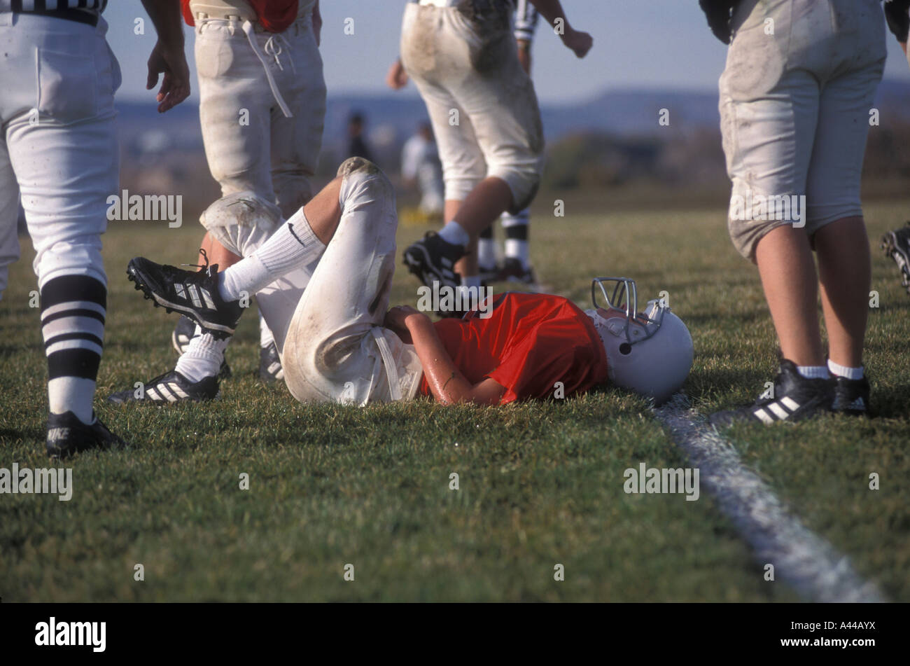 Youth football player injured, lying on the field Stock Photo Alamy
