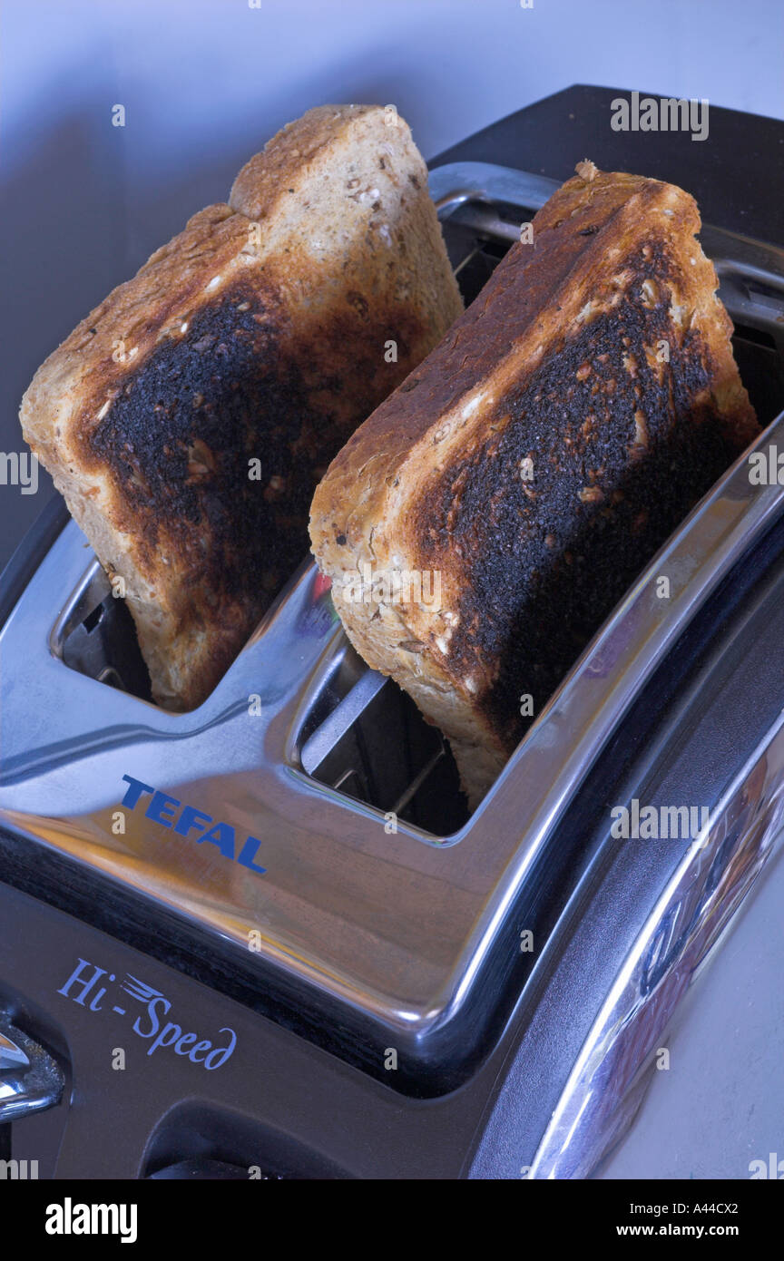 burnt toast in toaster burned Stock Photo Alamy
