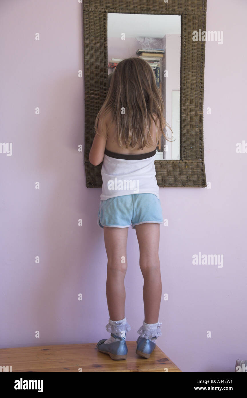 girl child in running shorts with mirror Stock Photo Alamy