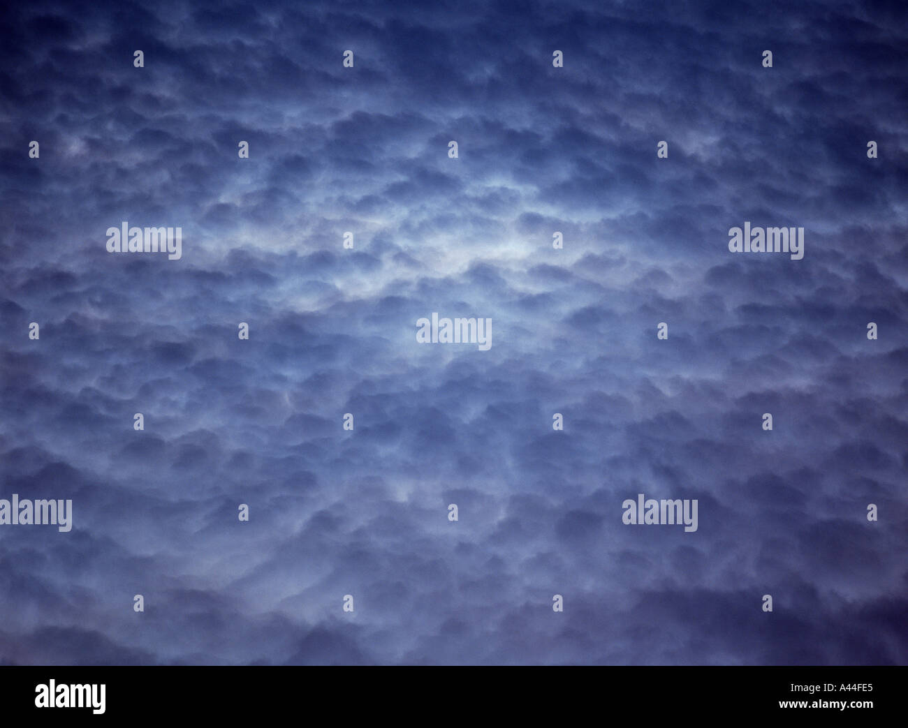 dh Clouds SKY WEATHER Pattern grey cloud with light area in middle Orkney Stock Photo