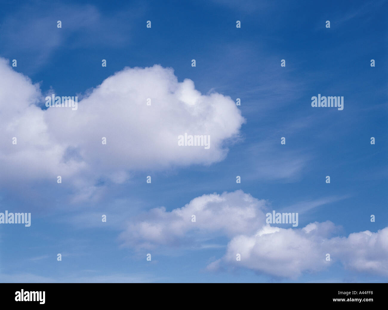 dh Clouds SKY WEATHER Puffy and whispy white cloud over blue sky serene Stock Photo