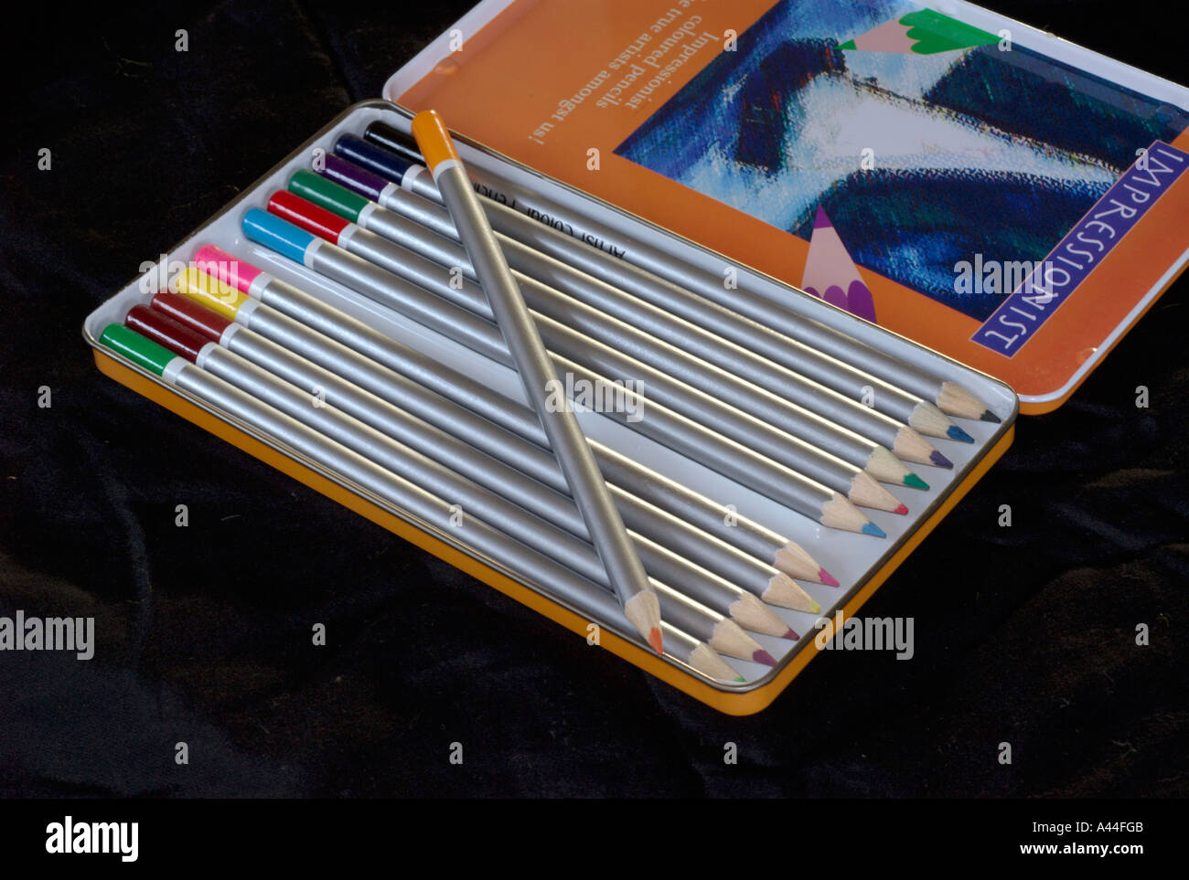 colour pencils in tin box Stock Photo Alamy